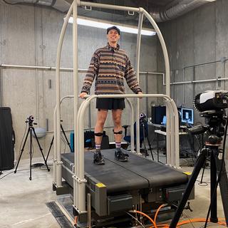 A male university student is walking on a treadmill for research 