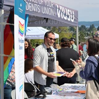 An advocacy tent for LGBT2+ on a university.