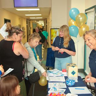 VIU tiwšɛmawtxw staff greeting members of the public