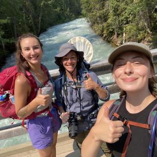 Lizzy Schafers, Jasmine Janes and Emma Peterson  give the thumbs up sign while taking a selfie.