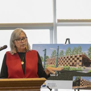 A person stands at a podium.