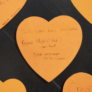 Orange heart reads "truth comes before reconciliation" and "Ganu tlalire lax" (don't forget) and kaeda gangananam (for the children)