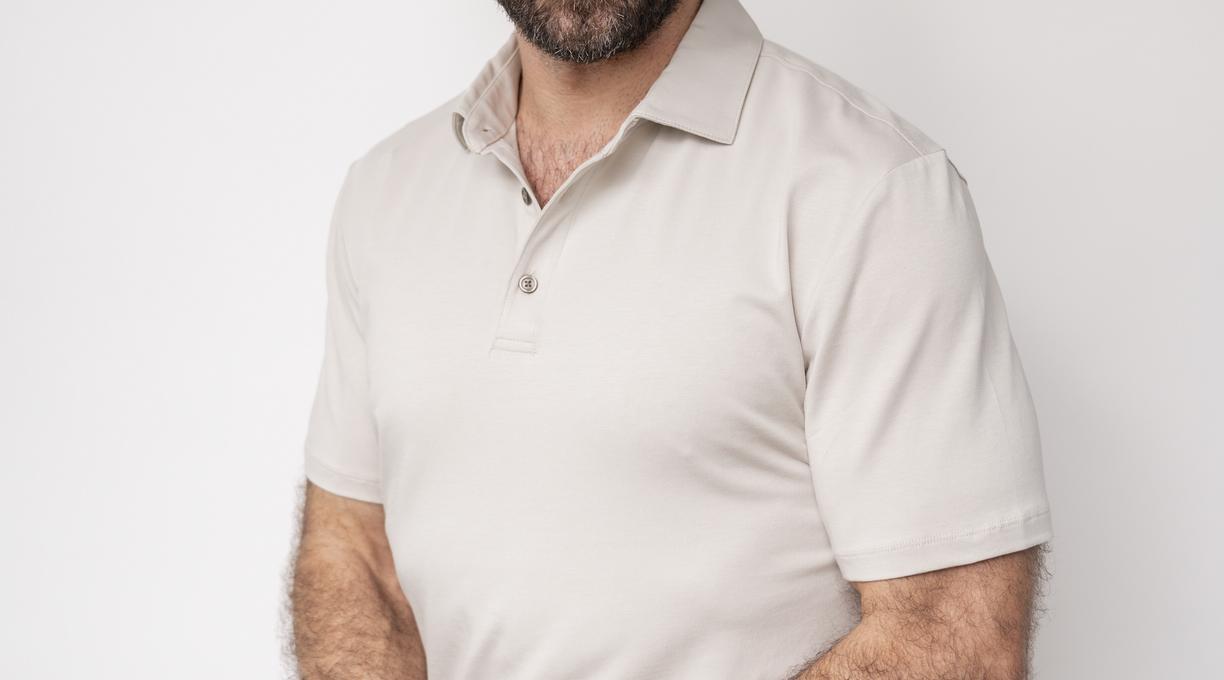 Jake torso and up portrait against a white wall