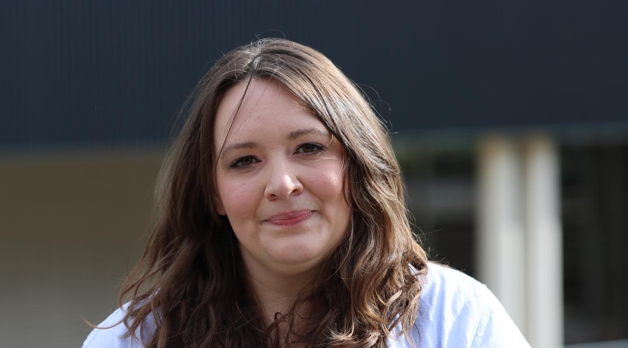 Laci standing outside and smiling at the camera