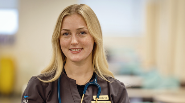 Christina smiling at the camera while wearing a VIU Nursing shirt.