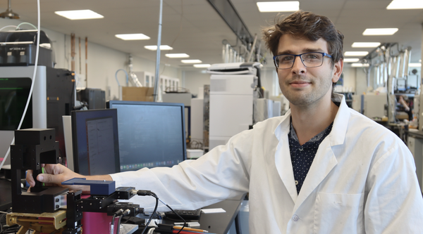 Joseph Monaghan in the lab showing the equipment
