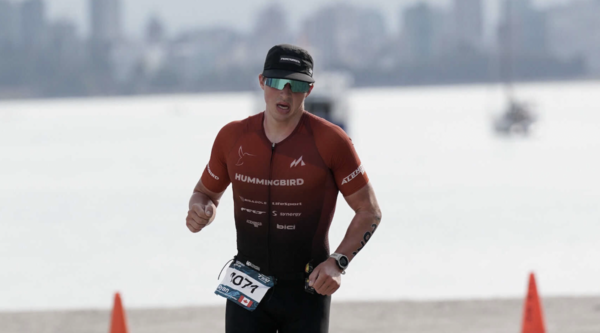 Ryan Seamn running outside during a triathlon.