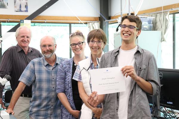 Jenn McGarrigle and her family celebrate with the first student they awarded a scholarship to in her mother's name - Sheila Marshall.