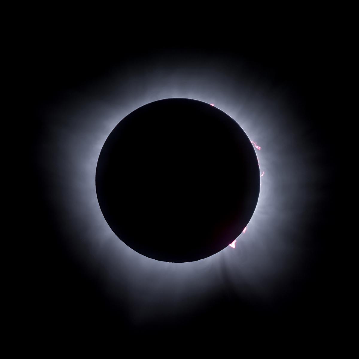 Close to the end of the eclipse solar can be seen behind the moon.