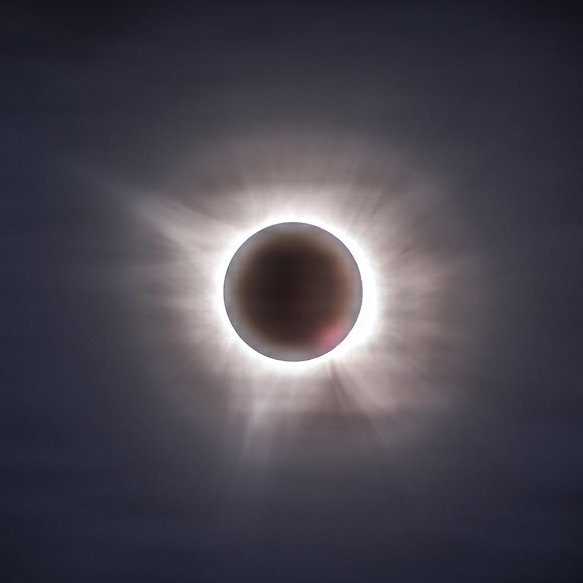 The fainter outer portions of the solar corona. Just like in children’s drawings of the Sun, the corona has a spiky, asymmetric shape to it and appears very different for every total solar eclipse.