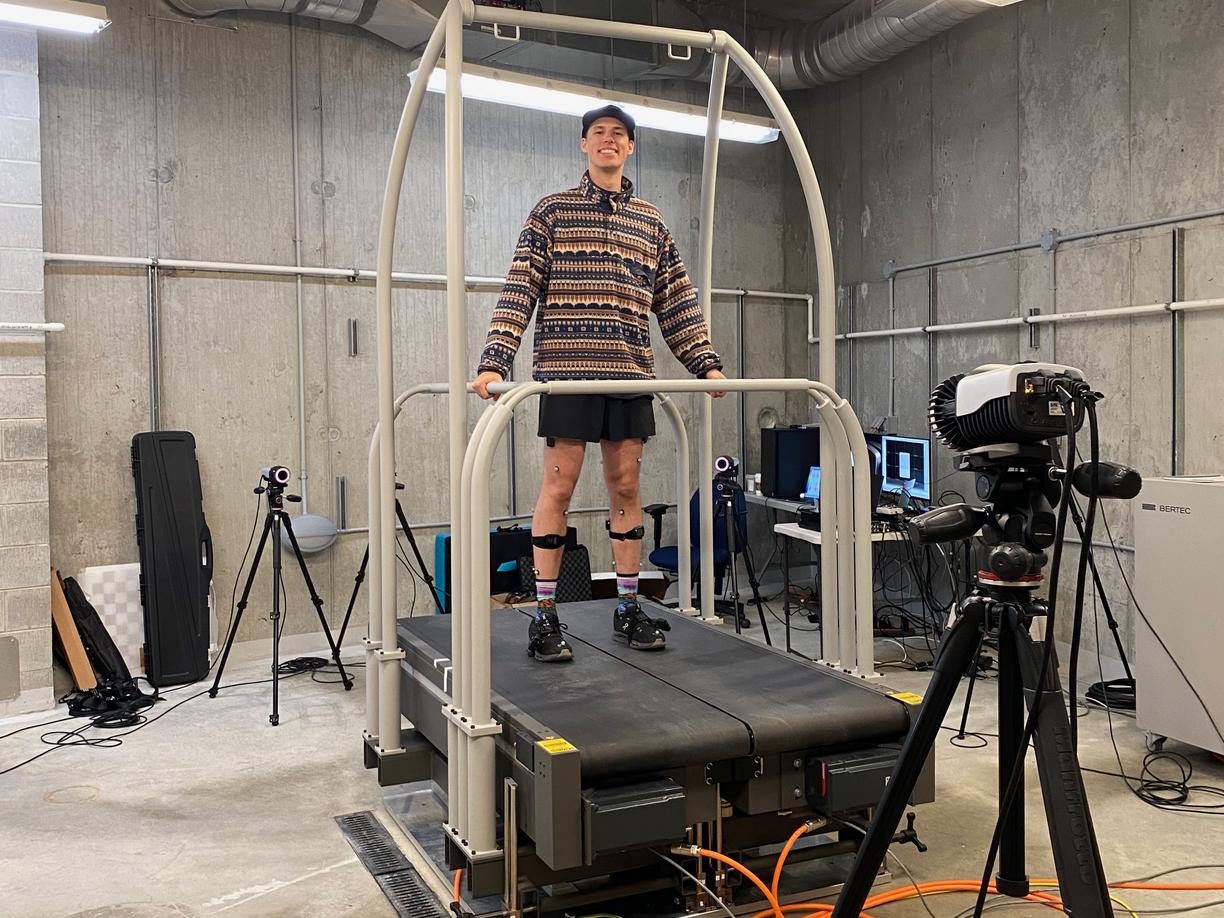 A male university student is walking on a treadmill for research 