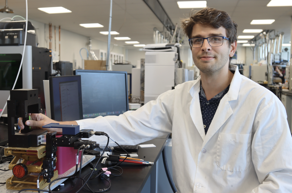 Joseph Monaghan in the lab showing the equipment
