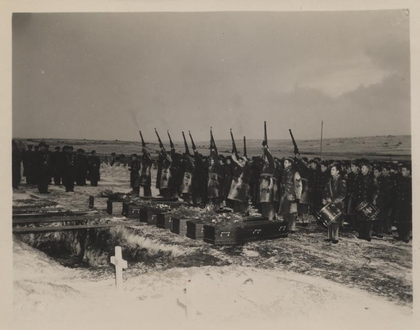 a gravesite with coffins ready to be buried