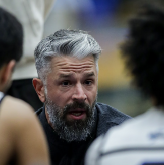 Matt Kuzminski having a word wityh his players during a game