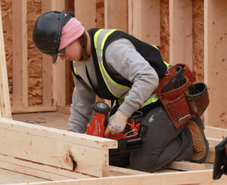 a VIU carpentry student working on a housing construction site