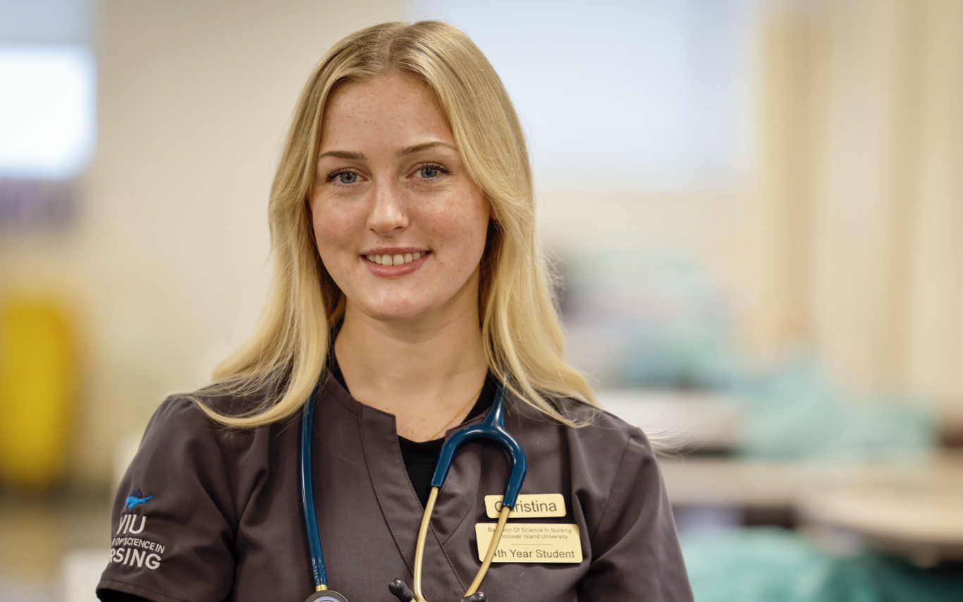 Christina smiling at the camera while wearing a VIU Nursing shirt.